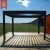 Pergola bioclimatica motorizzata per esterni, pergolato da giardino, pergolato da balcone, pergolato in alluminio con persiane in vetro regolabili e personalizzabili.